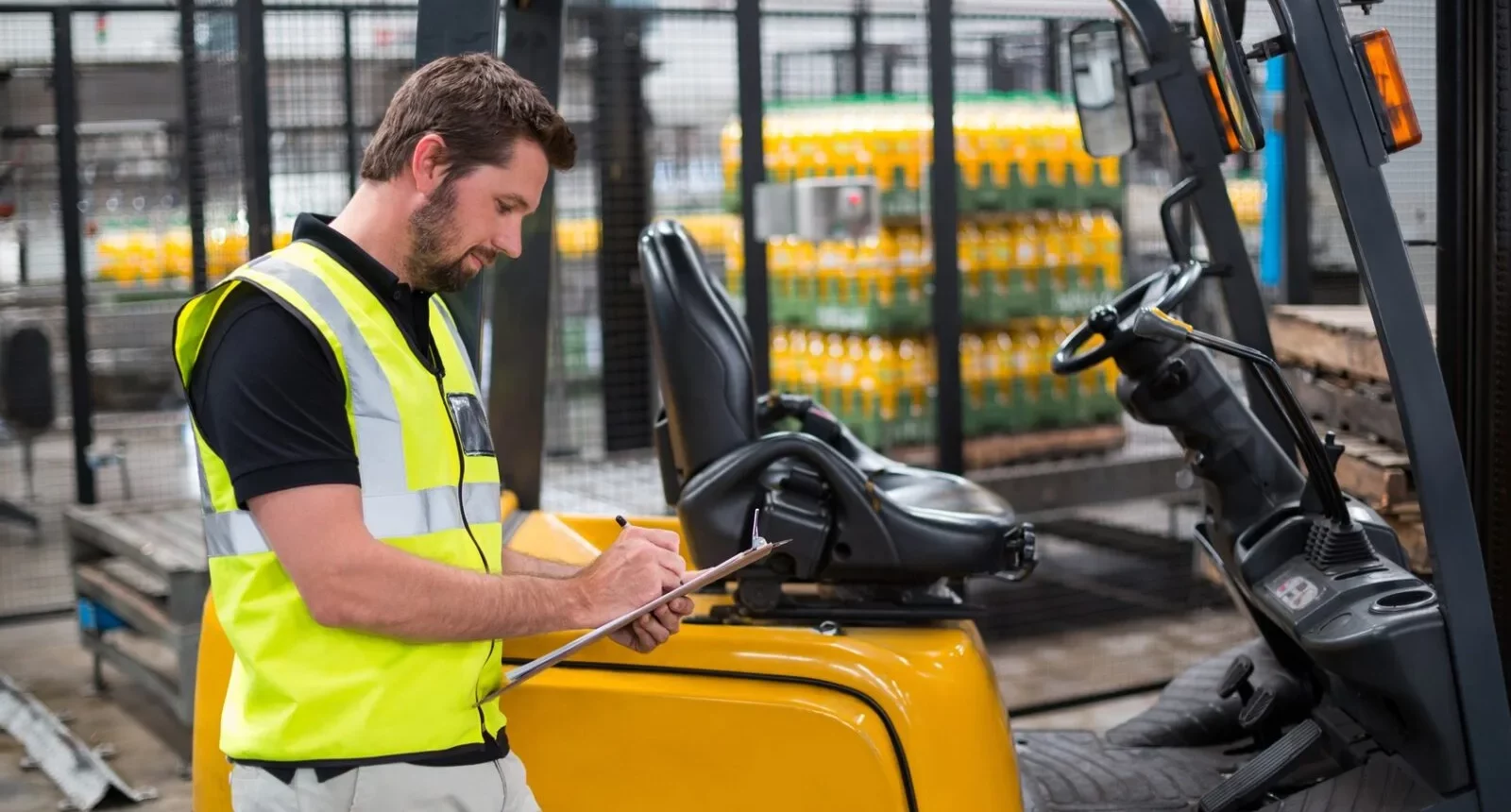 A Professional Keeping a Check on Forklifts
